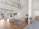 Bright living room featuring hardwood floors, large windows offering lots of natural light, and a high ceiling at 8531 N Shore Dr, Jonesboro, GA 30236