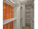 Spacious walk-in closet with shelving and wooden accents at 8531 N Shore Dr, Jonesboro, GA 30236