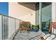 Relaxing balcony view with seating, potted plants, and a sliding glass door at 860 Peachtree St # 1418, Atlanta, GA 30308