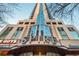 Modern condo building entrance with architectural glass and upscale signage at 860 Peachtree St # 1418, Atlanta, GA 30308