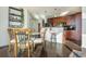 Charming kitchen seamlessly blending into the dining area, complete with wooden cabinetry and a convenient breakfast bar at 860 Peachtree St # 1418, Atlanta, GA 30308