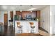 Modern kitchen featuring stainless steel appliances, dark wood cabinets, and a breakfast bar with seating at 860 Peachtree St # 1418, Atlanta, GA 30308