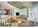 Bright open living area with hardwood floors, dining table, breakfast bar, and city views at 860 Peachtree St # 1418, Atlanta, GA 30308