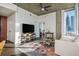 Comfortable living room with stylish decor, hardwood floors, city views, and cozy seating, perfect for relaxation at 860 Peachtree St # 1418, Atlanta, GA 30308