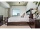Comfortable main bedroom offering city views, hardwood floors and a decorative rug at 860 Peachtree St # 1418, Atlanta, GA 30308