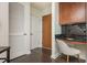 A practical office space with built in desk and drawers next to a closet and a door at 860 Peachtree St # 1418, Atlanta, GA 30308