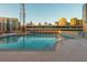 Rooftop swimming pool surrounded by city views and lounge chairs at 860 Peachtree St # 1418, Atlanta, GA 30308