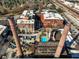 Unique aerial perspective highlighting brick buildings, a swimming pool, and historic smokestacks at 170 Boulevard Se # H428, Atlanta, GA 30312