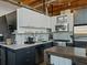 Close up of modern kitchen featuring stainless steel appliances, light countertops, and dark cabinets at 170 Boulevard Se # H428, Atlanta, GA 30312
