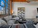 Cozy living room with brick wall, comfortable seating, and a modern bookshelf at 170 Boulevard Se # H428, Atlanta, GA 30312