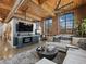 Open-concept living room with exposed brick, high ceilings, modern finishes, and comfortable seating arrangement at 170 Boulevard Se # H428, Atlanta, GA 30312