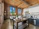Bright open concept living space featuring exposed brick, wood ceilings, and modern kitchen at 170 Boulevard Se # H428, Atlanta, GA 30312