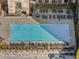Aerial view of a sparkling pool surrounded by lounge chairs, umbrellas, and a well-maintained patio area at 170 Boulevard Se # H428, Atlanta, GA 30312