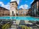 Beautiful pool with views of historic brick construction and lounge furniture at 170 Boulevard Se # H428, Atlanta, GA 30312