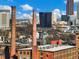 Dramatic view of Atlanta skyline with historic smokestacks in foreground at 170 Boulevard Se # H428, Atlanta, GA 30312