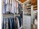 Custom walk-in closet with built-in shelving, drawers, and ample hanging space for optimal storage solutions at 170 Boulevard Se # H428, Atlanta, GA 30312