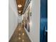 Hallway with polished concrete floors and modern art fixtures under an open ceiling at 170 Boulevard Se # H428, Atlanta, GA 30312