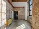 Lobby area with exposed brick walls, concrete floors, an exit, and a large window at 170 Boulevard Se # H428, Atlanta, GA 30312