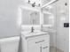 Modern bathroom featuring a sleek vanity, illuminated mirror, and a stylish glass-enclosed shower at 2917 Mcafee Rd, Decatur, GA 30032