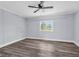 Bedroom with modern ceiling fan, soft grey walls, and beautiful hardwood floors at 2917 Mcafee Rd, Decatur, GA 30032