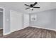 Cozy bedroom featuring a ceiling fan, two closets and lovely flooring at 2917 Mcafee Rd, Decatur, GA 30032