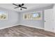 Cozy bedroom with ceiling fan, hardwood floors and soft grey walls at 2917 Mcafee Rd, Decatur, GA 30032