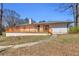 Charming one-story home with a spacious wood deck and well-manicured lawn at 2917 Mcafee Rd, Decatur, GA 30032