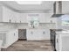 Modern kitchen featuring white cabinets, stainless steel appliances, and stylish countertops at 2917 Mcafee Rd, Decatur, GA 30032