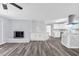 Open-concept living room with a beautiful fireplace, modern flooring, and great natural light at 2917 Mcafee Rd, Decatur, GA 30032