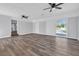 Open-concept living room features lots of space, wood floors and sliding glass door at 2917 Mcafee Rd, Decatur, GA 30032