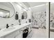 Modern bathroom with marble-tiled shower, dual sinks, and sleek black fixtures at 4184 Westchester Ne Trce, Roswell, GA 30075