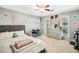 Bedroom with a queen-sized bed, study desk, and ample natural light at 4184 Westchester Ne Trce, Roswell, GA 30075