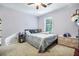 Cozy bedroom with a twin bed, window, and colorful decor at 4184 Westchester Ne Trce, Roswell, GA 30075