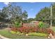A landscaped entrance to the Westchester community with colorful flowers and lush greenery at 4184 Westchester Ne Trce, Roswell, GA 30075