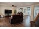 Hardwood floors, open floor plan, fireplace, and a ceiling fan in this naturally lit home at 4184 Westchester Ne Trce, Roswell, GA 30075