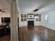 Bright living room features hardwood floors, fireplace, and built in shelving at 4184 Westchester Ne Trce, Roswell, GA 30075