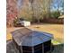 Spacious backyard featuring a screened gazebo, storage shed, and mature trees offering privacy at 501 Owens Springs Ln, Mcdonough, GA 30252