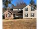 Inviting two-story home featuring a charming front porch and beautiful curb appeal at 501 Owens Springs Ln, Mcdonough, GA 30252