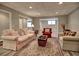 Comfortable basement living room featuring stylish furnishings, creating a cozy and inviting space for relaxation at 112 Estates At The Lake Dr, Canton, GA 30114