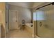 Luxurious bathroom with a glass shower, soaking tub and neutral tile at 112 Estates At The Lake Dr, Canton, GA 30114