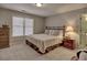 Comfortable bedroom with plush carpet, natural light, and a relaxing atmosphere at 112 Estates At The Lake Dr, Canton, GA 30114