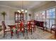 Formal dining room with china cabinet, large windows, and elegant decor at 112 Estates At The Lake Dr, Canton, GA 30114