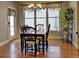 Bright dining room with large windows and adjacent door leading to outdoor space at 112 Estates At The Lake Dr, Canton, GA 30114