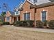 Close-up view of brick home with walkway and manicured shrubbery at 112 Estates At The Lake Dr, Canton, GA 30114