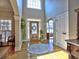 Welcoming foyer with hardwood floors, arched entryways and large windows at 112 Estates At The Lake Dr, Canton, GA 30114