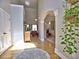 Charming foyer showcasing hardwood floors leading to the living spaces at 112 Estates At The Lake Dr, Canton, GA 30114