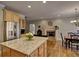 Open-concept kitchen with granite countertops and stainless steel appliances at 112 Estates At The Lake Dr, Canton, GA 30114