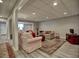 Basement living room featuring comfortable seating and a cozy atmosphere at 112 Estates At The Lake Dr, Canton, GA 30114