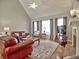 Open living room with brick fireplace, hardwood floors, and large windows at 112 Estates At The Lake Dr, Canton, GA 30114