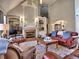 Bright and airy living room featuring a fireplace, hardwood floors, and open layout at 112 Estates At The Lake Dr, Canton, GA 30114